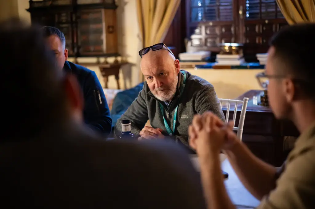 Peter listening closely at the table in Seville