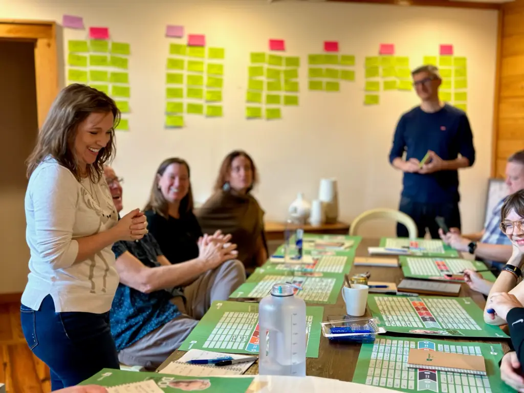An operator mapping out a plan with sticky notes on a board
