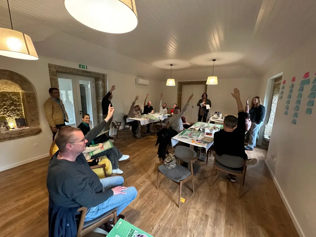 Operators raising hands to vote in a workshop